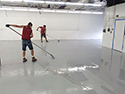 Men Installing an Epoxy Floor Coating