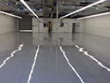 Industrial Concrete Floor with Reflection of Lights