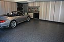 Epoxy Floor Flake Installation with Silver Car